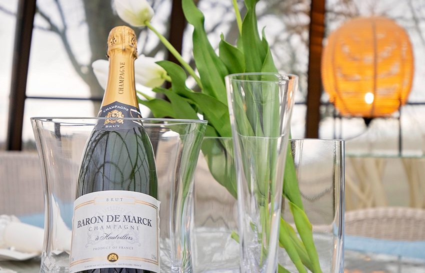 A bottle of champagne on a table at Aspen Spa